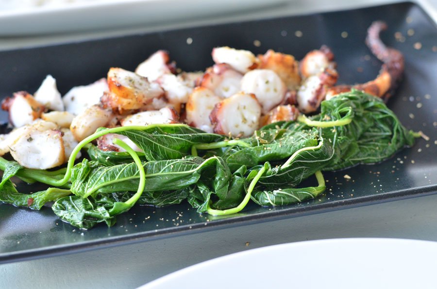 fresh grilled octopus in restaurant, Mykonos, Greece / Stasha Travel and Fashion Blog 